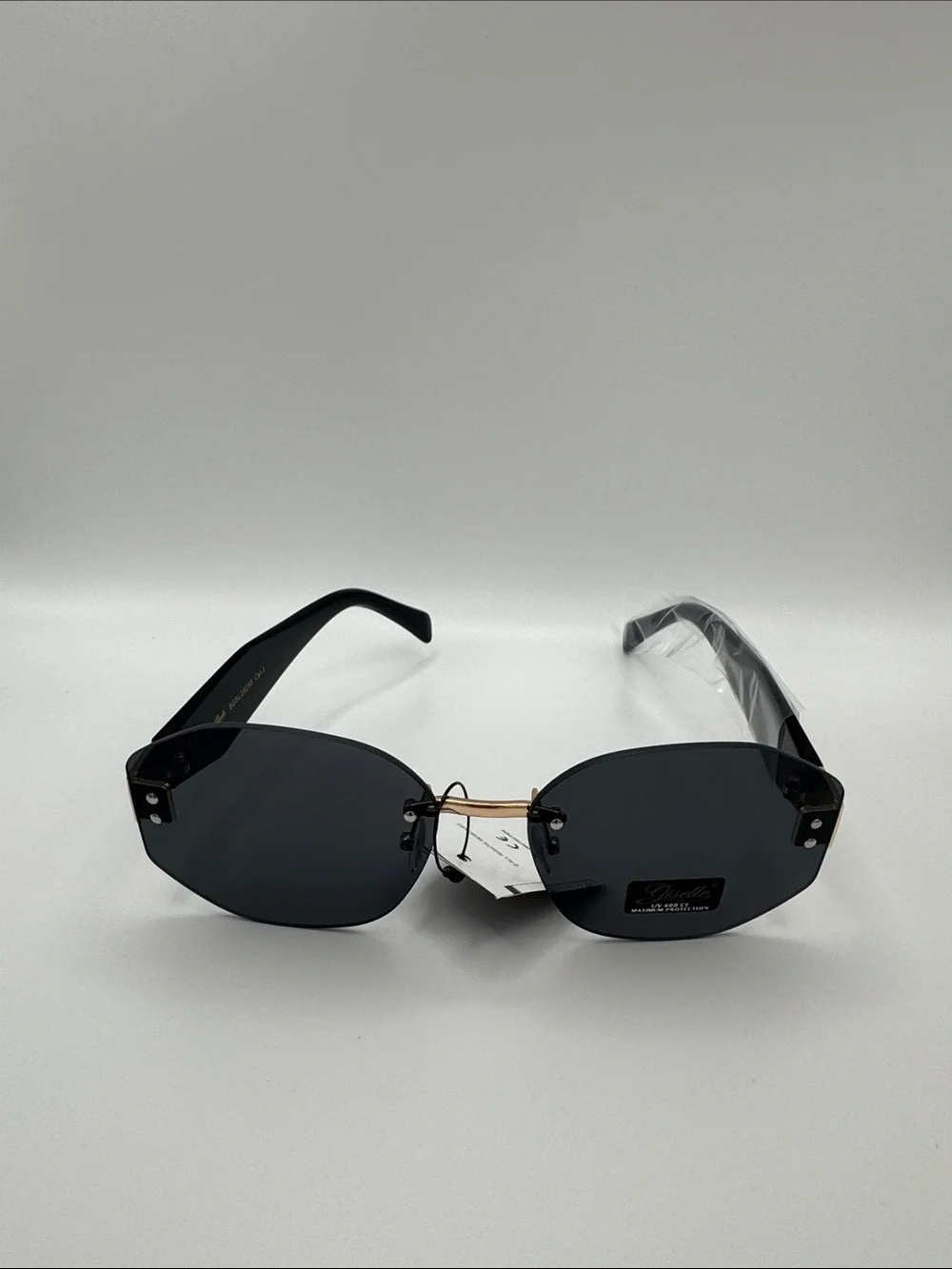 Stylish Black Rimless Women's Sunglasses with Gold Bridge